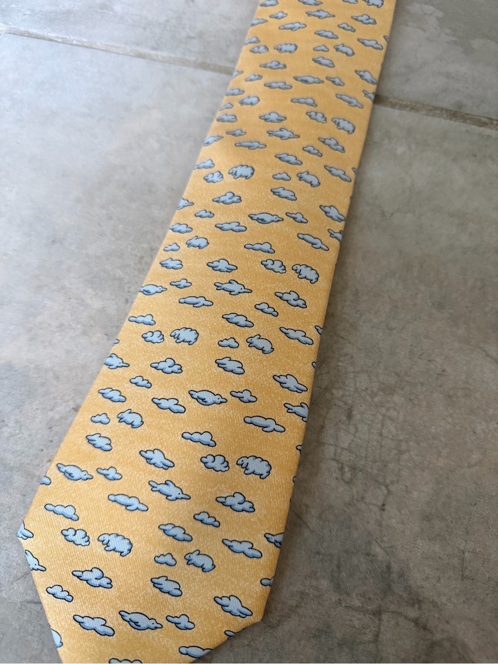 HERMES 100% silk tie with cloud and animal print, orange and blue made in France